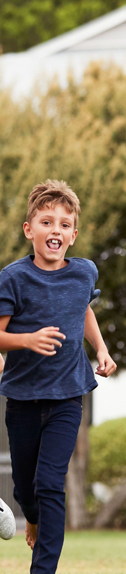 Students running outside — a picture from the flagship school