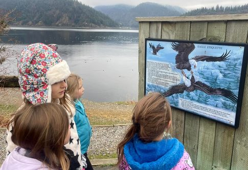 River Tech children exploring nature beside a lake