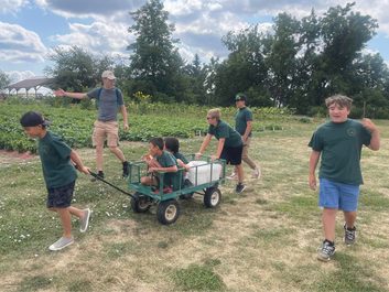 River Tech students outdoors with a project